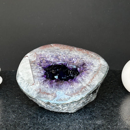 Amethyst gemstone, amethyst and quartz geode
