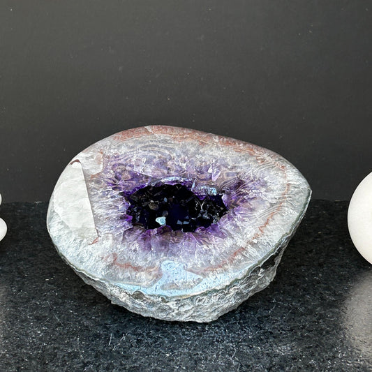 Amethyst gemstone, amethyst and quartz geode