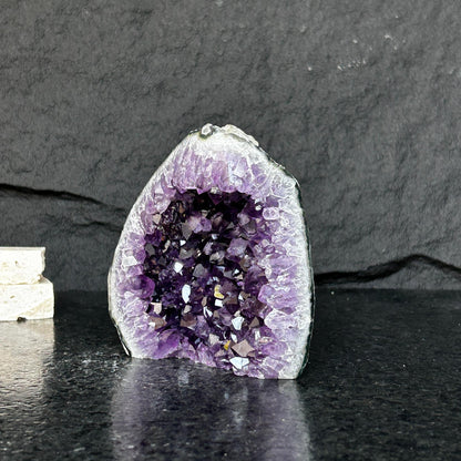 Amethyst stone agate edges, crystal geode from Uruguay, cut base self standing stone