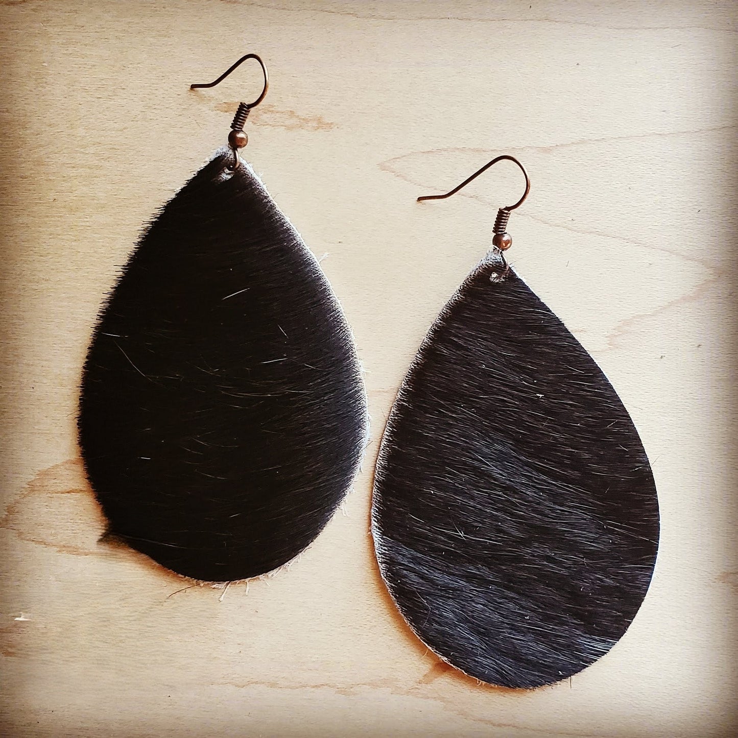 **Leather Teardrop Earrings in Dark Hair on Hide 202L